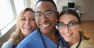 three nurses take selfie together